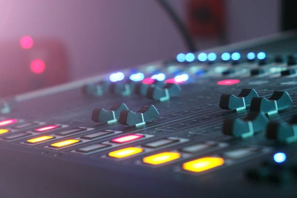 istock The audio mixer in the Studio, the handles move up and down, all ready to record. 1032803982