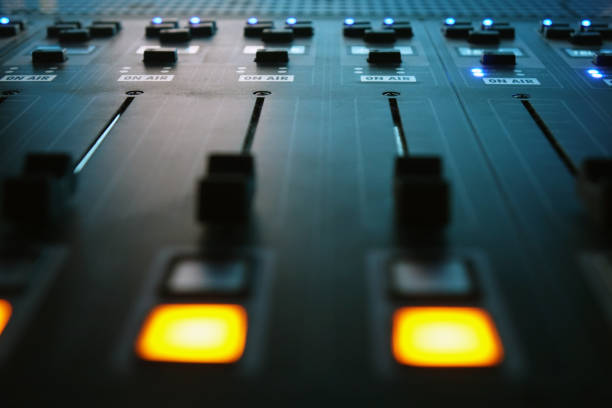istock The audio mixer in the Studio, the handles move up and down, all ready to record. 1032804018