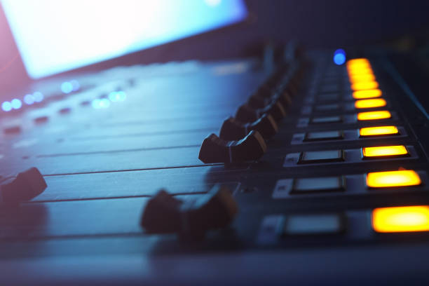 istock The audio mixer in the Studio, the handles move up and down, all ready to record. 1032804044