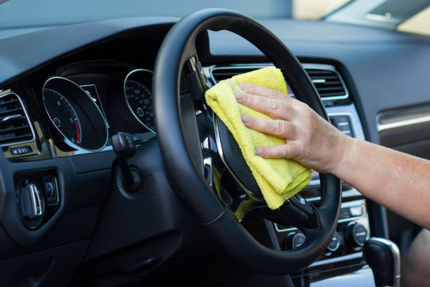 istock Hand with cloth cleaning car interior 1032804206