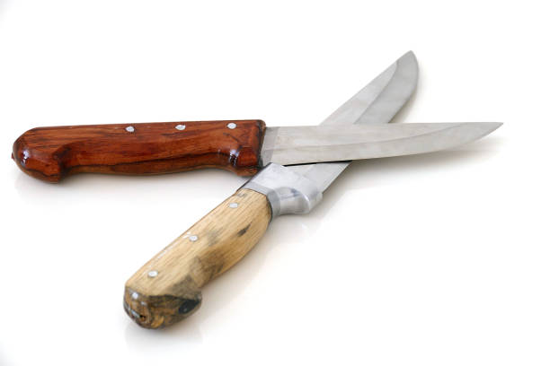 istock sharp turkish knives with wooden handle on white ground, 1032806396