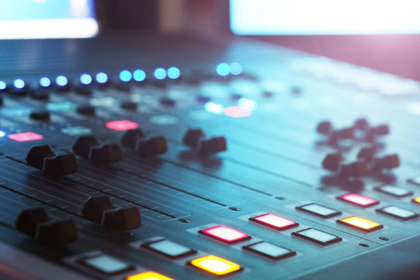 istock The audio mixer in the Studio, the handles move up and down, all ready to record. 1032806480