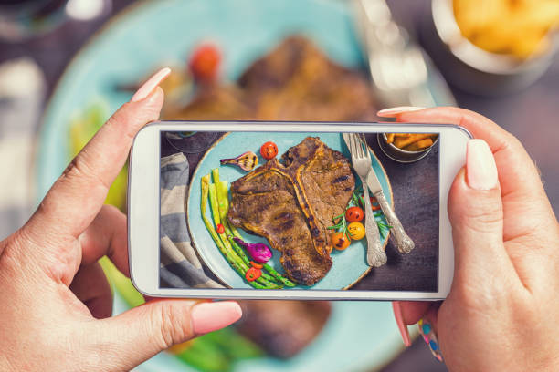 istock Taking Photo of Roasted T-Bone Steak 1032807516