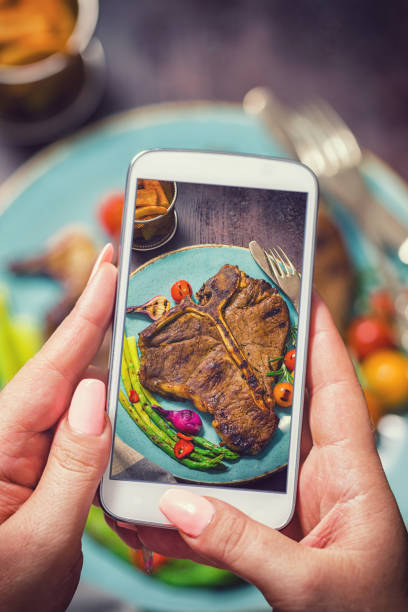 istock Taking Photo of Roasted T-Bone Steak 1032807604