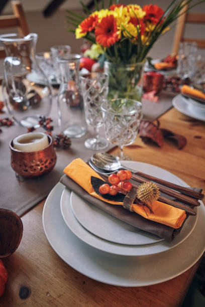 istock Decorated Table for Thanksgiving Dinner with Candles, Pumpkins, Leafs and Nuts 1032820082