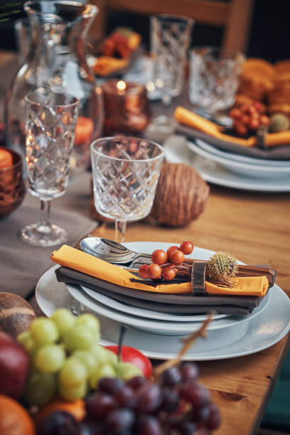istock Decorated Table for Thanksgiving Dinner with Candles, Pumpkins, Leafs and Nuts 1032820096