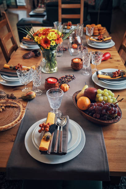 istock Decorated Table for Thanksgiving Dinner with Candles, Pumpkins, Leafs and Nuts 1032820110