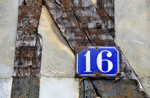 istock house number 16 on antique rustic wall, old, rusty enamel sign 1032854214