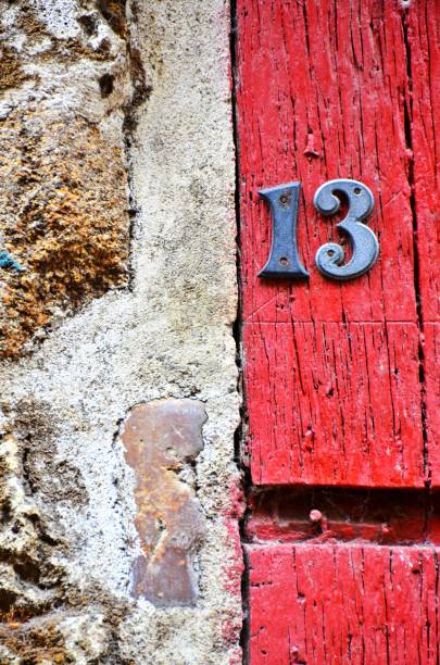istock house number 13 on antique rustic wall, old, rusty metal numbers 1032856436