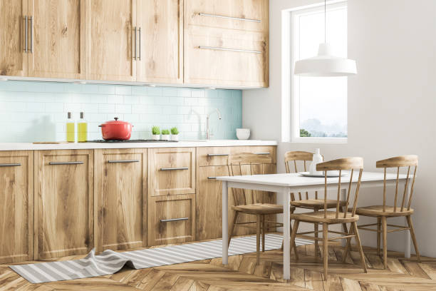 istock Red cooking pot on wooden kitchen counter, table 1032859430