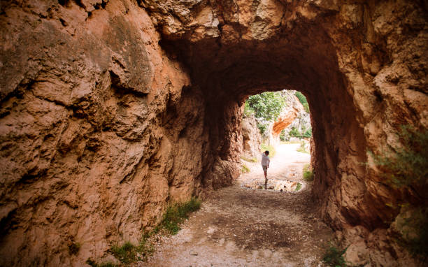 Boy Backpacking in majestic canyon