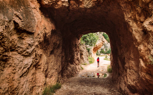 istock Girl Backpacking in majestic canyon 1032861950