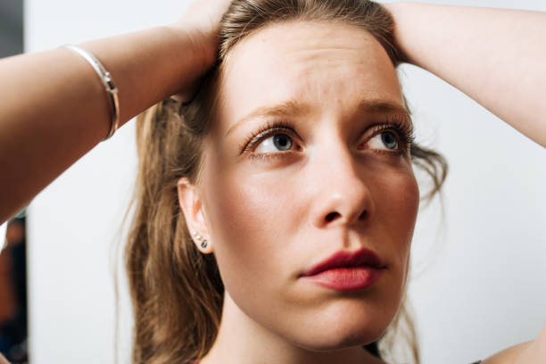 istock Alone and anxious young woman at home 1032877148