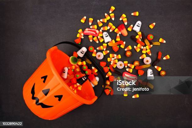 Halloween Jack O Lantern Pail Top View With Spilling Candy Stock Photo - Download Image Now