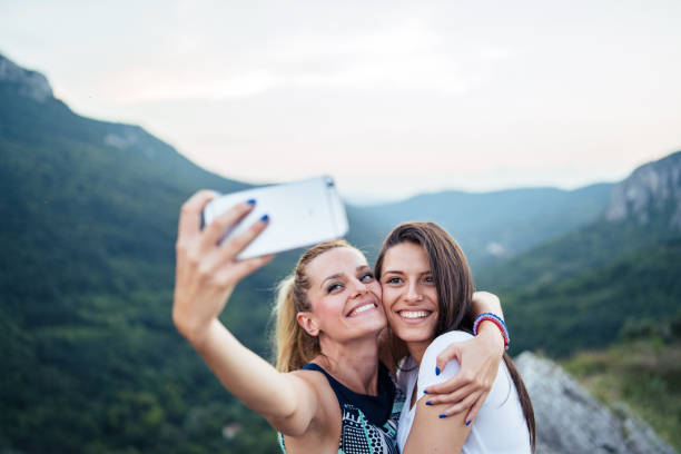 istock Friends take selfie on mountain range 1032890572