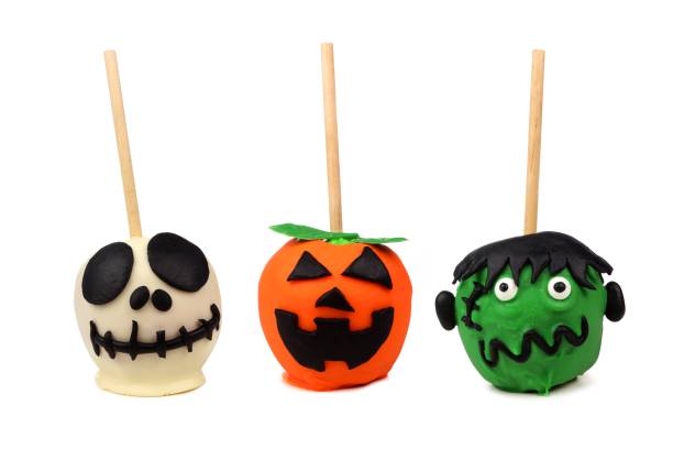 istock Three unique Halloween candy apples isolated on white 1032896022