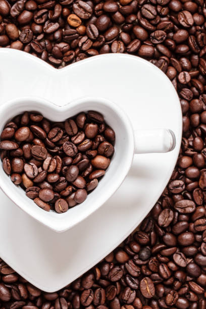 istock cup and saucer on coffee beans background 1032901160