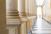 Colonnade, row of classical stone columns, background with copy spaced