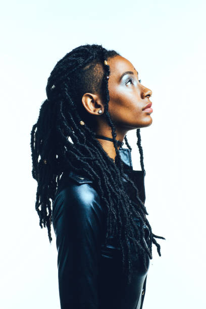 Profile Of A Woman With In Black Latex Top And Long Dreadlocks Looking Up  Stock Photo - Download Image Now - iStock