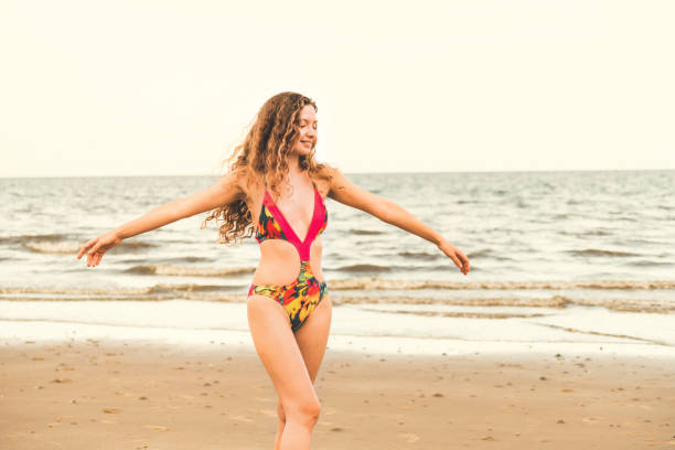 istock Happy young woman at beach in summer vacation. 1032930822