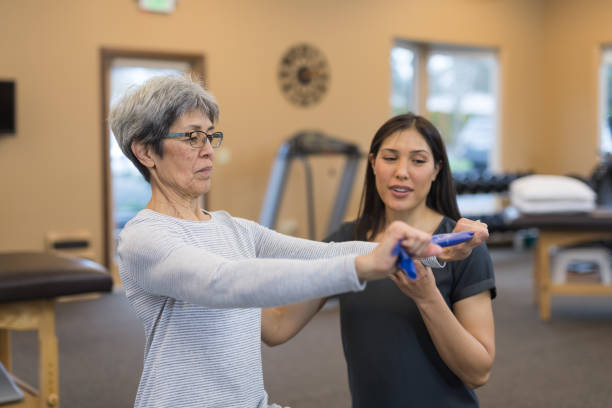 istock A senior woman works with her occupational therapist 1032931028