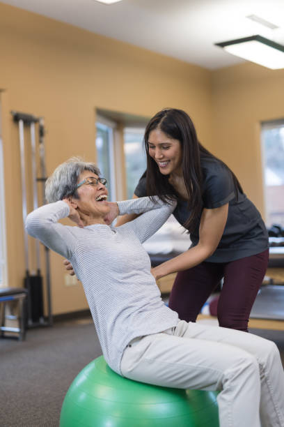 istock A senior woman works with her occupational therapist 1032931032