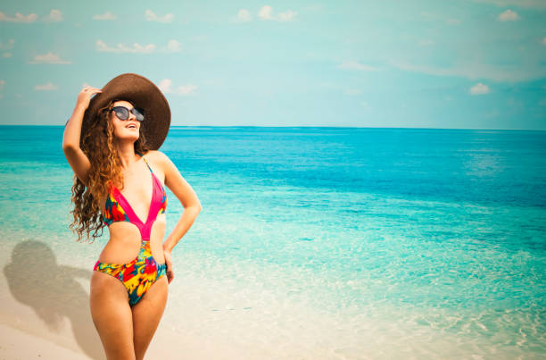 istock Happy young woman at beach in summer vacation. 1032931038
