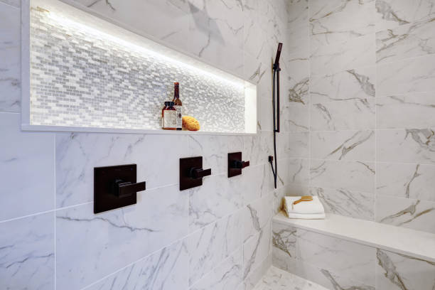 istock Master modern bathroom interior in luxury home with white  shower and marble tiles 1032935596