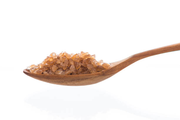 istock Brown rock sugar isolated on white 1032935760