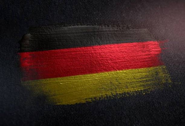 флаг германии из металлической кисти на гранж темная стена - german culture flash стоковые фото и изображения