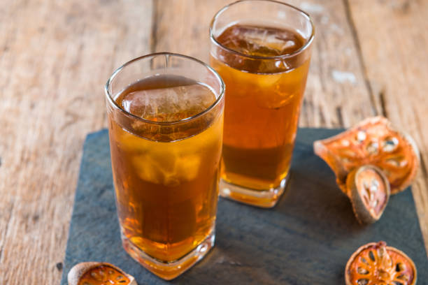 istock Bael juice ice tea on wooden table , healthy drink 1032935958