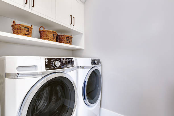 istock White clean laundry room modern with washer and dryer 1032938400