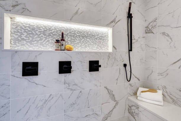 istock Master modern bathroom interior in luxury home with white  shower and marble tiles 1032938540