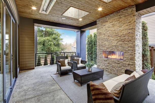 istock Luxury modern deck exterior with stone fireplace and wooden ceiling 1032940600