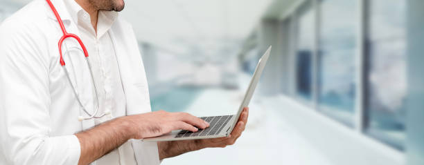 istock Doctor using laptop computer at the hospital. 1032940792