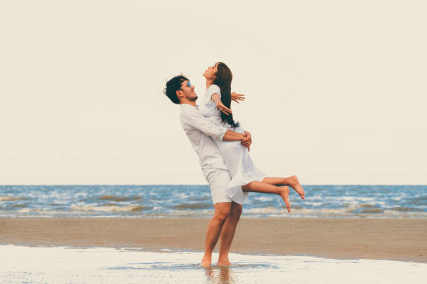 istock Couple going honeymoon on tropical beach in summer 1032940942