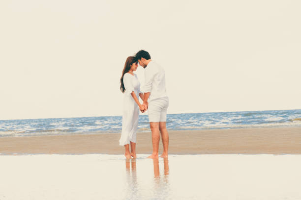 istock Couple going honeymoon on tropical beach in summer 1032940956