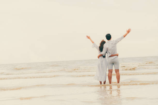 istock Couple going honeymoon on tropical beach in summer 1032941002
