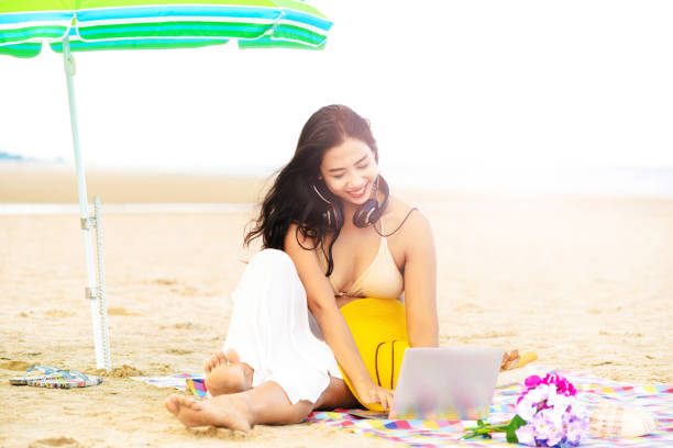 istock Plus size young woman sitting on the beach. 1032941124