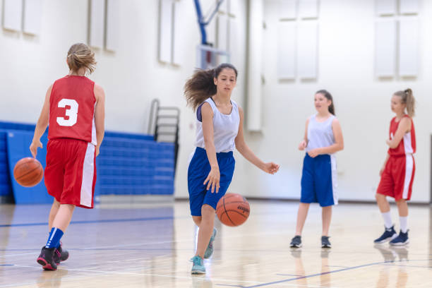 istock Co-ed teen basketball team practicing 1032950348