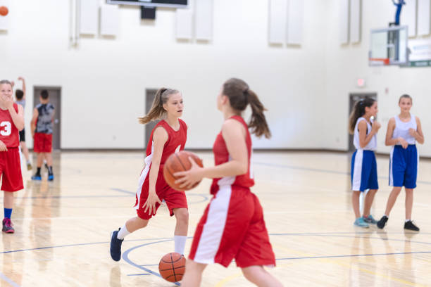 istock Co-ed teen basketball team practicing 1032950350
