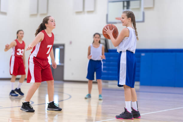 istock Co-ed teen basketball team practicing 1032950358