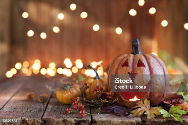 Halloween Pumpkin Against An Old Wood Background Stock Photo - Download Image Now - Halloween, Autumn, Pumpkin