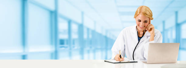 istock Doctor using laptop computer at the hospital. 1032952714