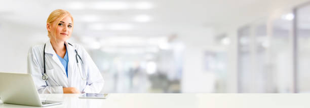 Doctor using laptop computer at the hospital.