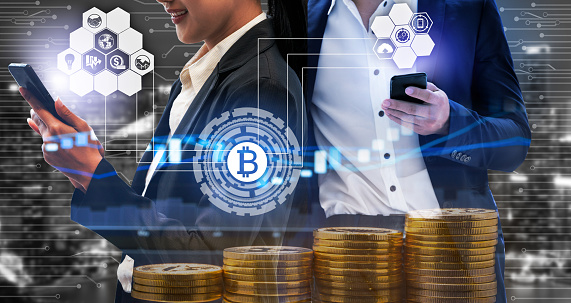 Bitcoin and cryptocurrency investing concept - Businessman using mobile phone application to trade Bitcoin BTC with another trader in modern graphic interface. Blockchain and financial technology.