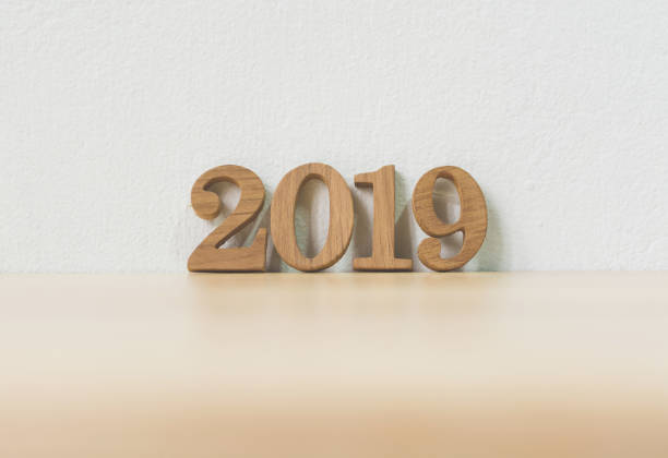istock New years resolution 2019 concept. Wooden year number on table 1032972118