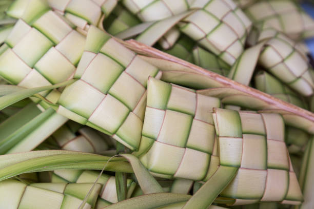 istock Ketupat, dumpling made of woven palm leaf stuffed with rice 1032977836