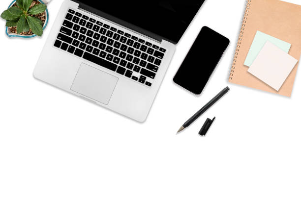 istock Flat lay photo of office table with laptop computer, digital tablet, mobile phone and accessories. on isolated white background. Desktop office mockup concept. 1032989746