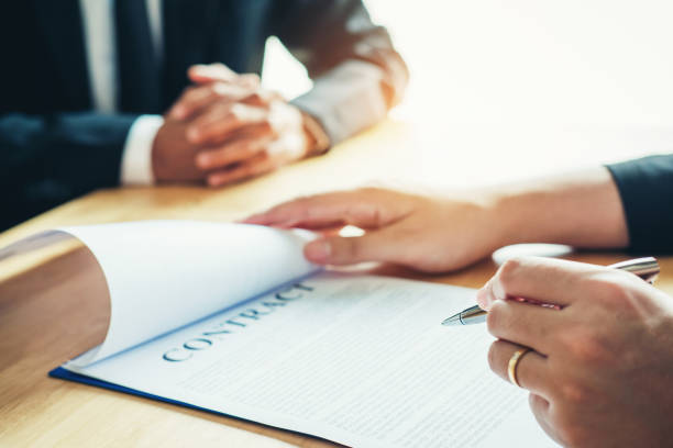istock Business people negotiating a contract  between two colleagues 1033011066